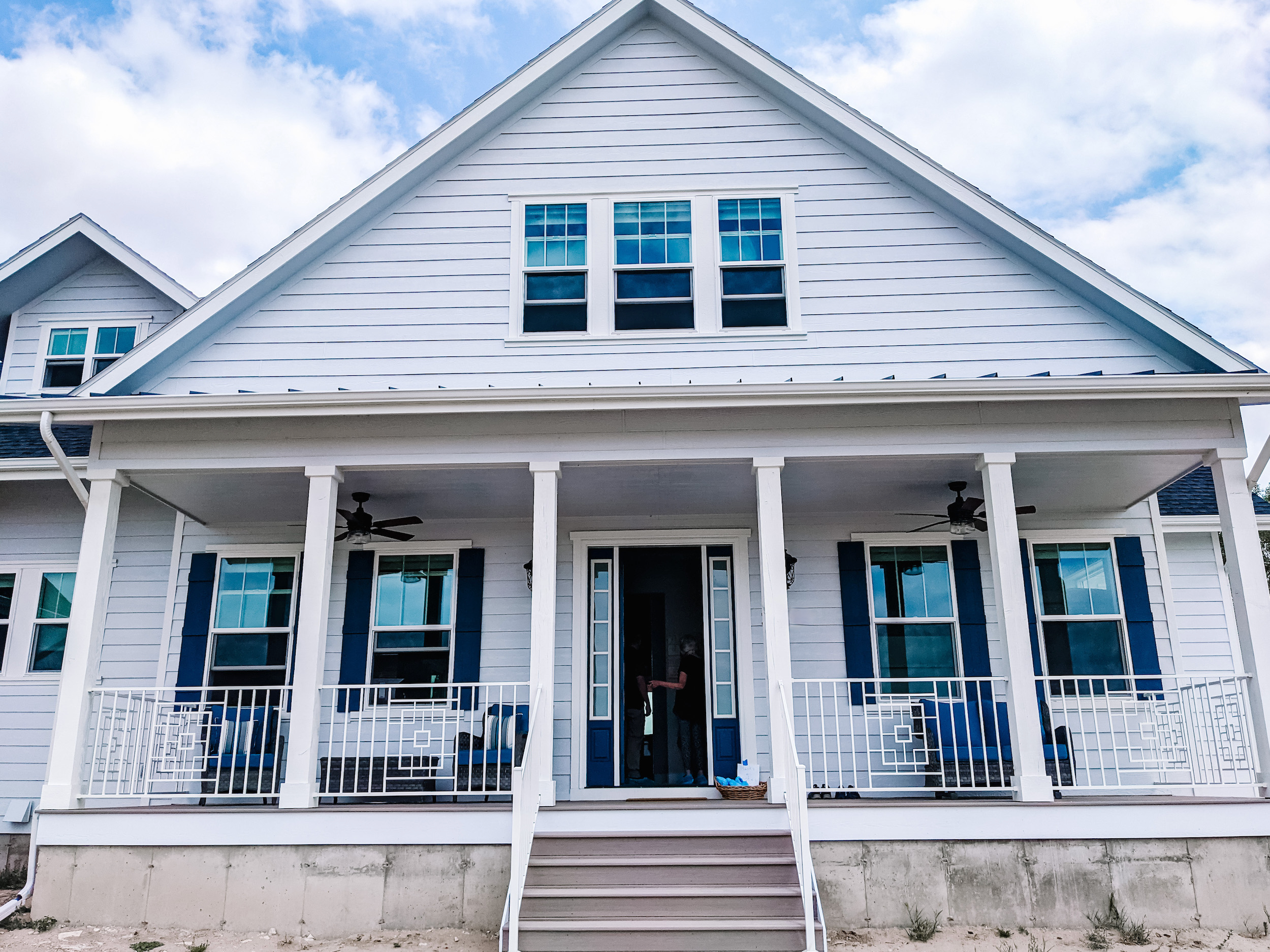Modern farmhouse exterior with covered front porch.