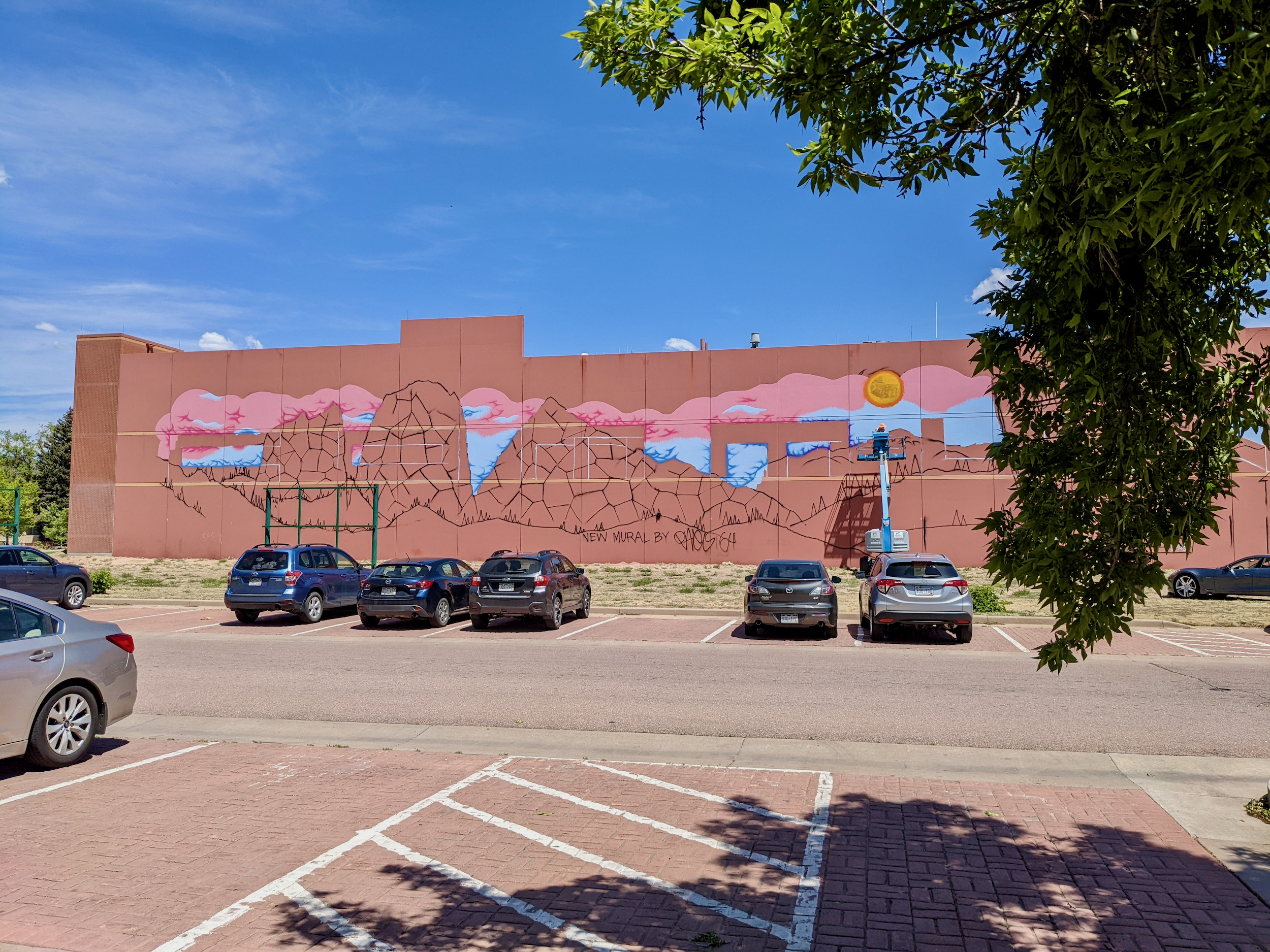  We’ve enjoyed having a front-row seat to see the mural come to life. The artist worked from a lift he could operate himself. 
