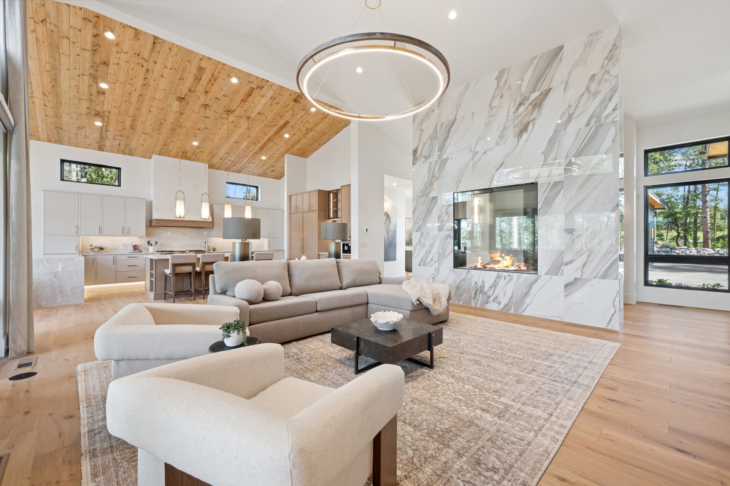 Marble fireplace impresses in contemporary home interior.