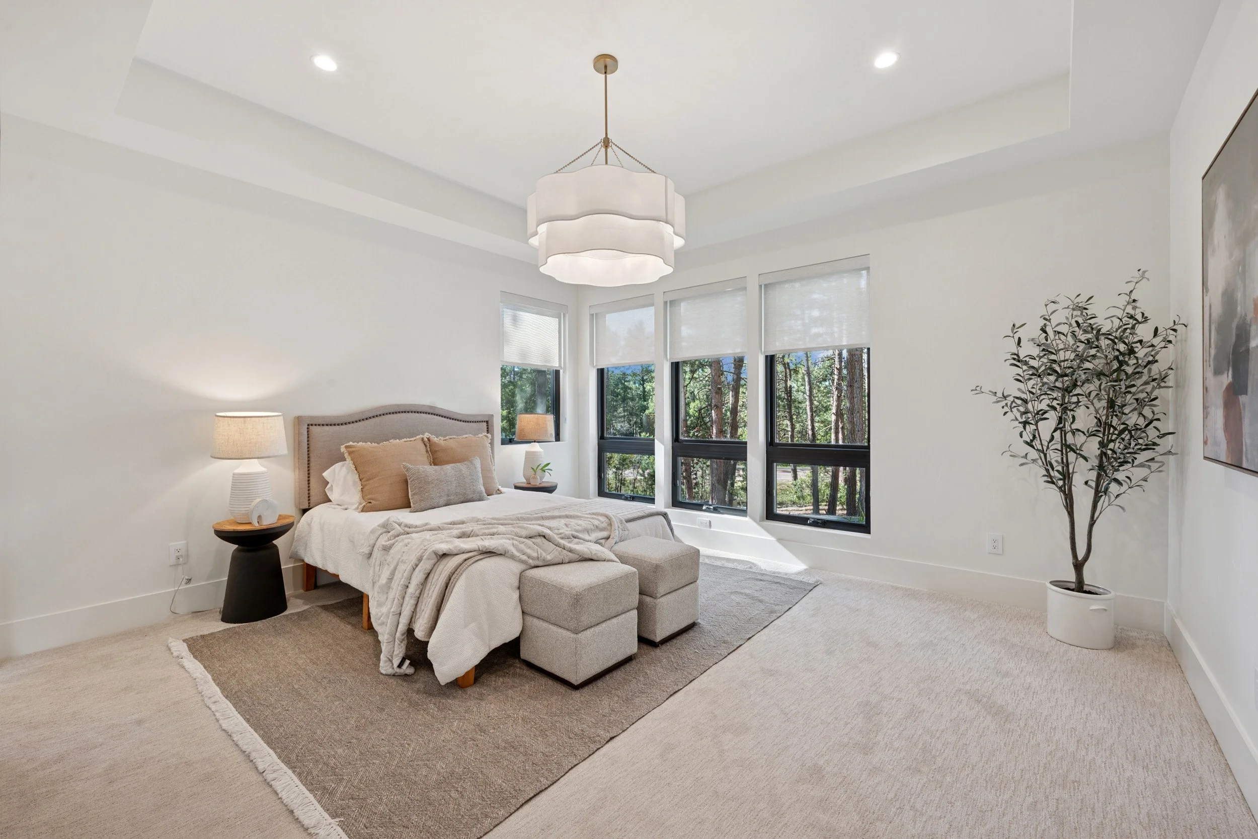Contemporary primary suite in custom home.