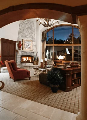 Luxury Colorado custom home with arched entry into vaulted great room. 