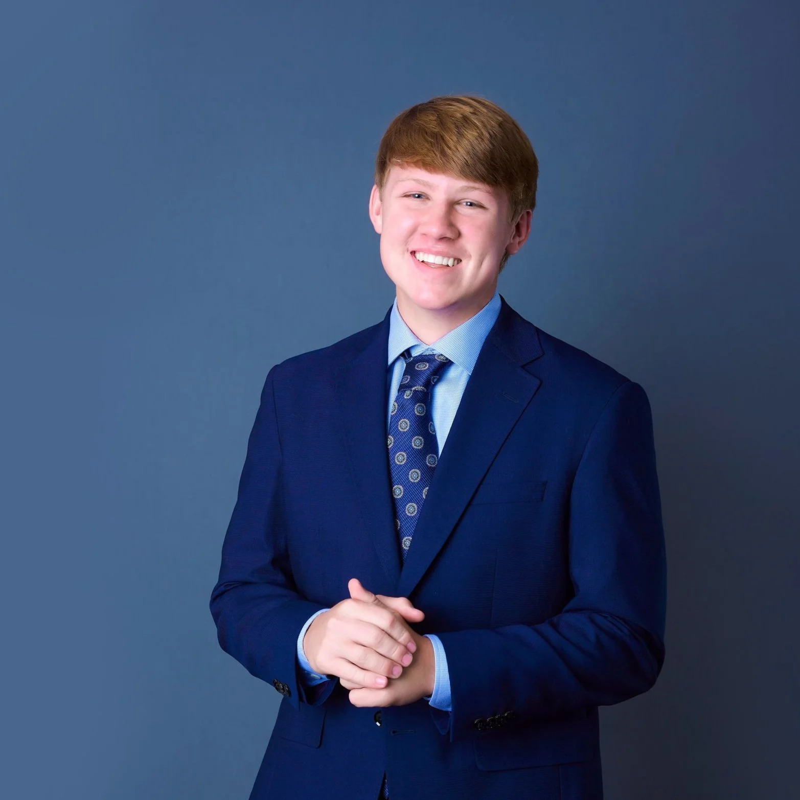 Senior Year Graduation Headshots in Blue Suit and tie formal portrait handsome young man posing studio session Bridgette Bloomquist