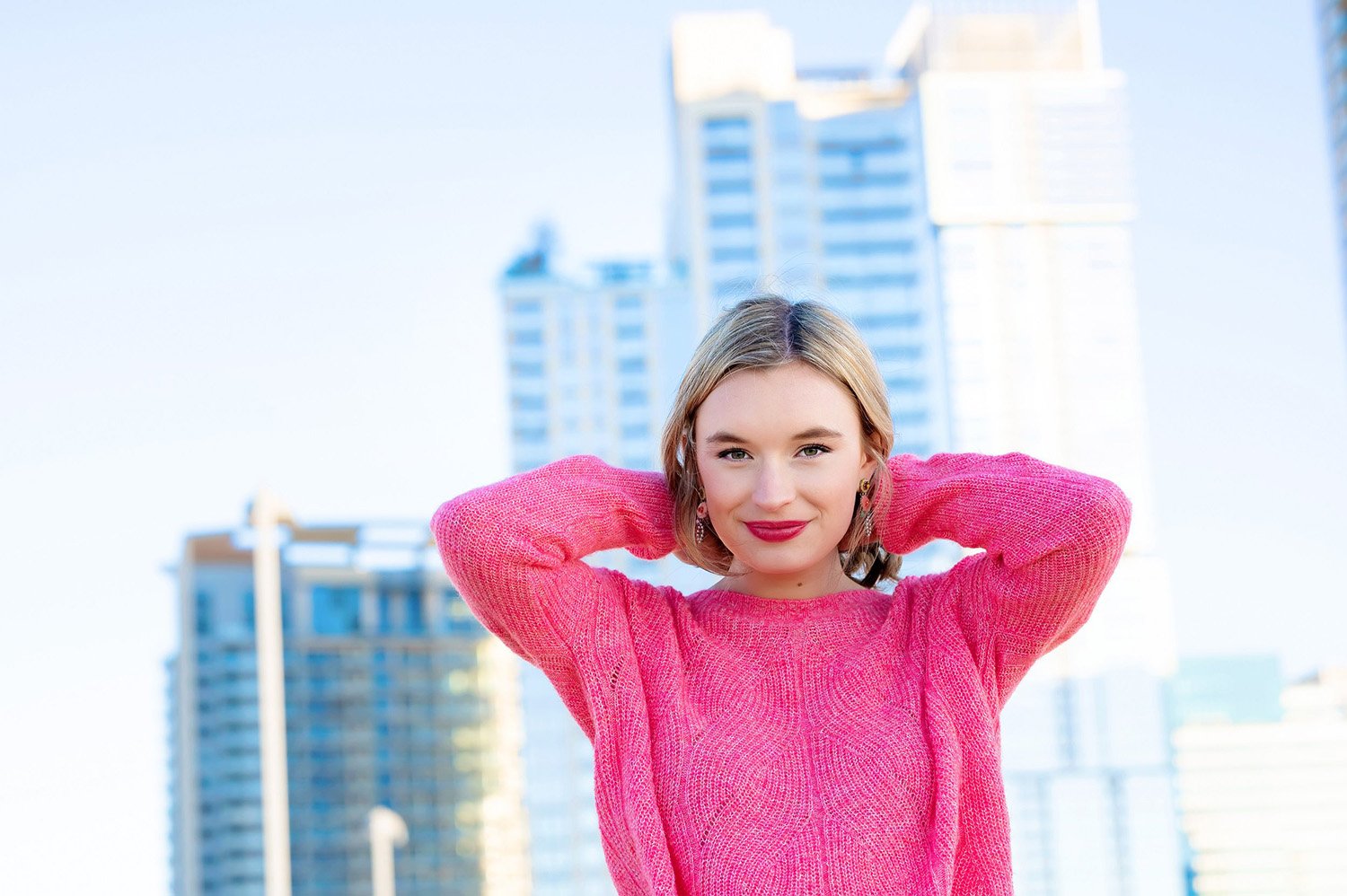 Senior Wearing Pink Sweater