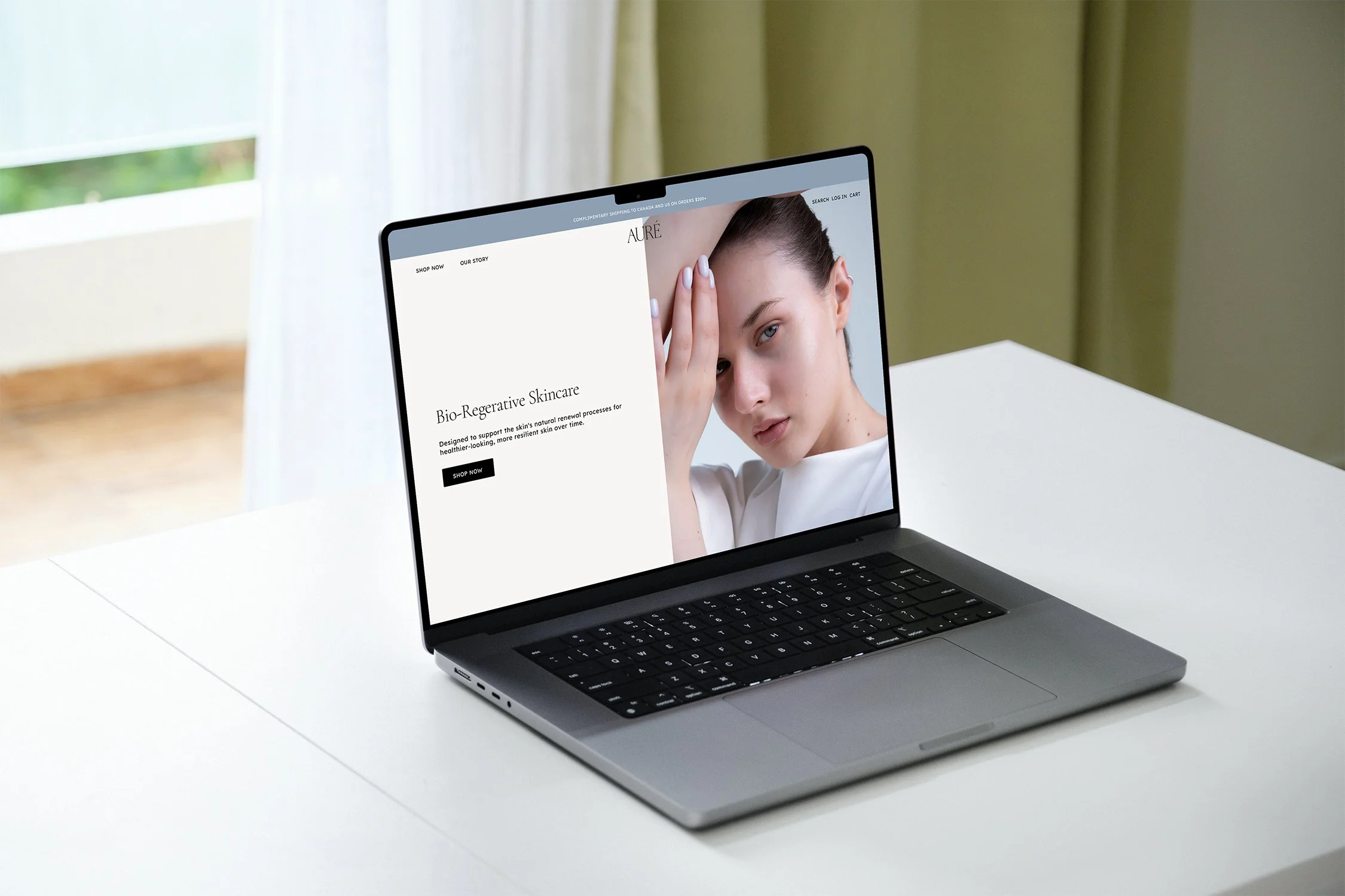 Laptop displaying a skincare product website with a woman touching her face.