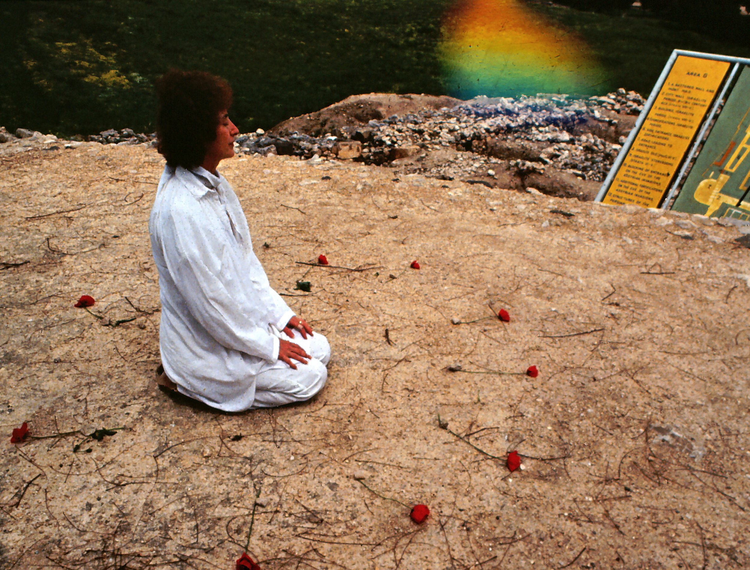 Beth Ames Swartz praying before painting at sacred Tel Hazor, Israel 1980