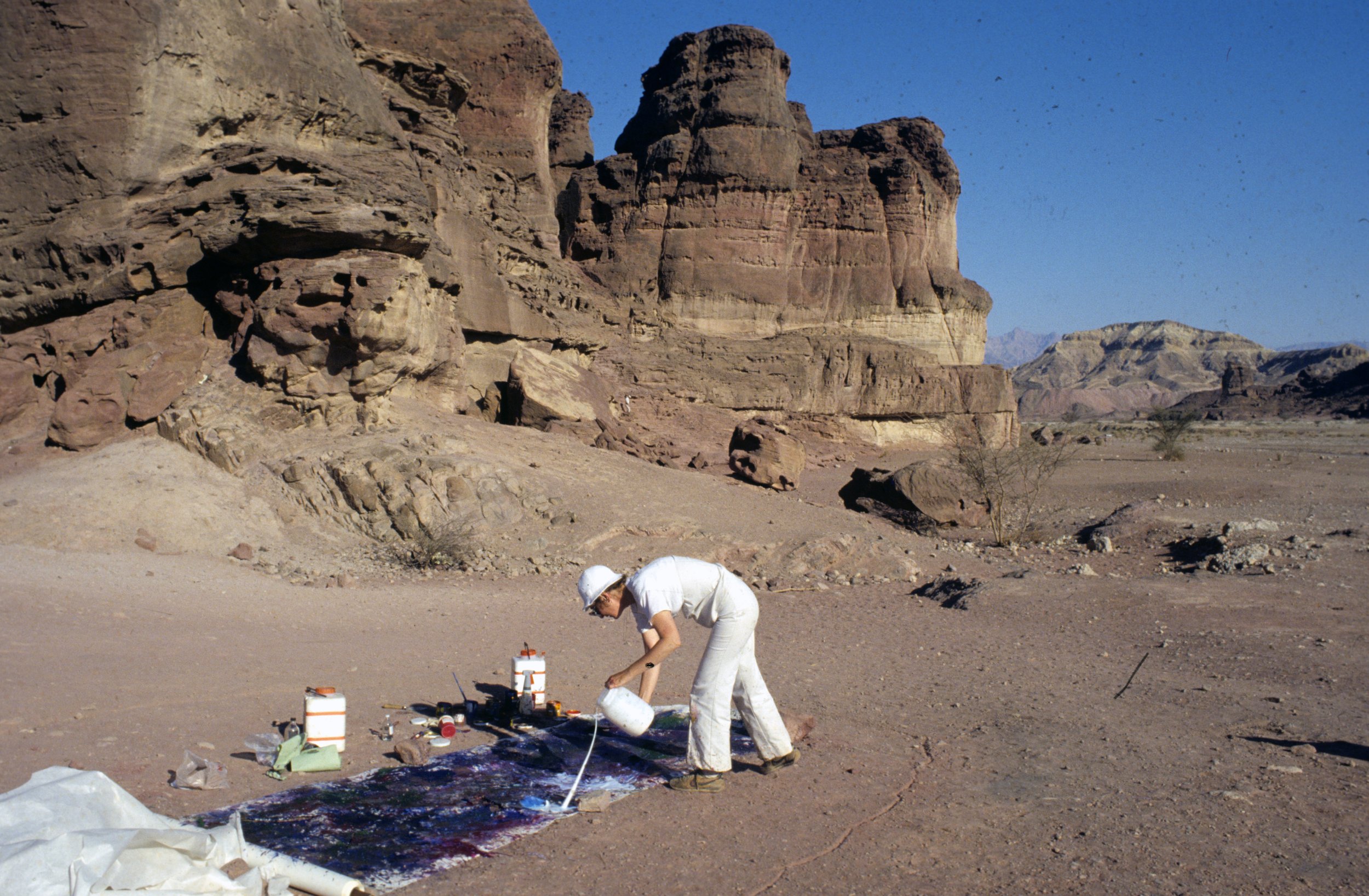 Beth Ames Swartz painting at Solomon's Pillars (Timna Valley, Israel), 1980