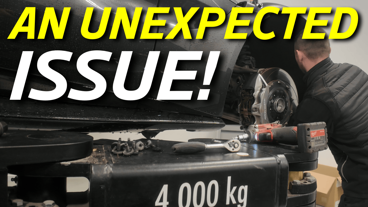 A person working on a 2019 Aston Martin Vantage (known as the 'FTP Vantage') engine with tools, with the text 'An Unexpected Issue!' in bold yellow and white letters overlaying the image.