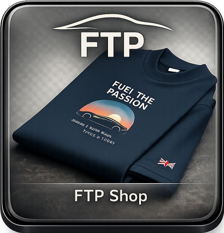 A folded navy blue T-shirt with the text "FUEL THE PASSION" and a graphic of a car with a sunset background. The shirt has a small logo of the Union Jack flag stitched on the sleeve. The image also has text "FTP" and "FTP Shop".