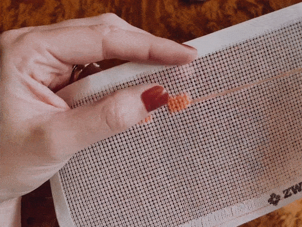 GIF tutorial of how to end a needlepoint thread