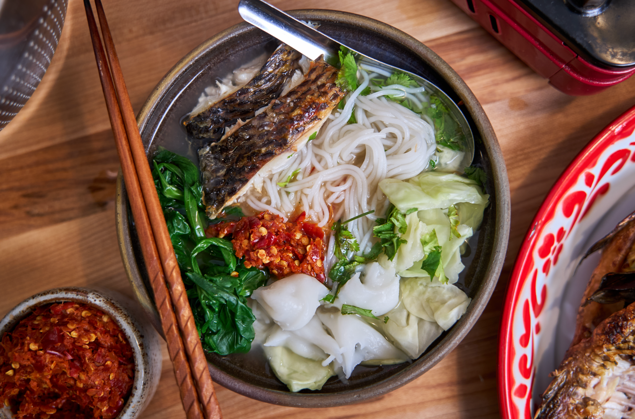 top down photo of vermicelli noodles with grilled fish