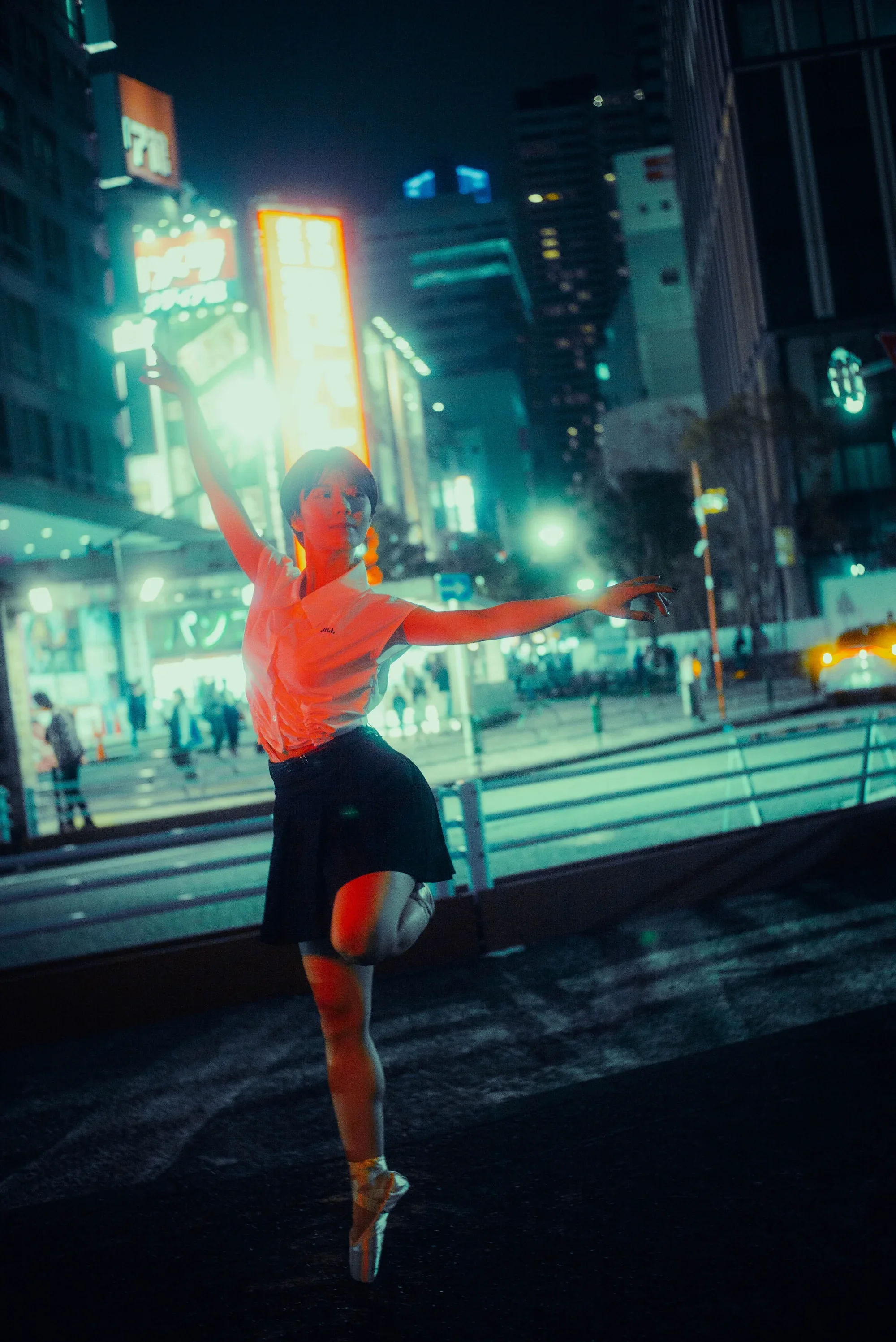 Solo portrait with dramatic red lighting on the streets of Tokyo at night