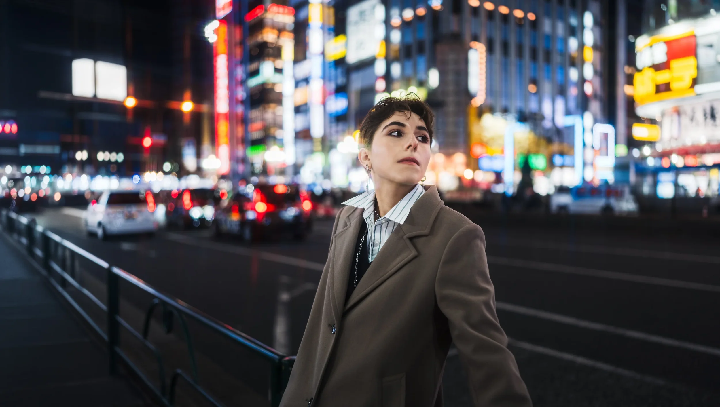 Fashion portrait in Shibuya with colorful Tokyo city lights during a professional street style photoshoot