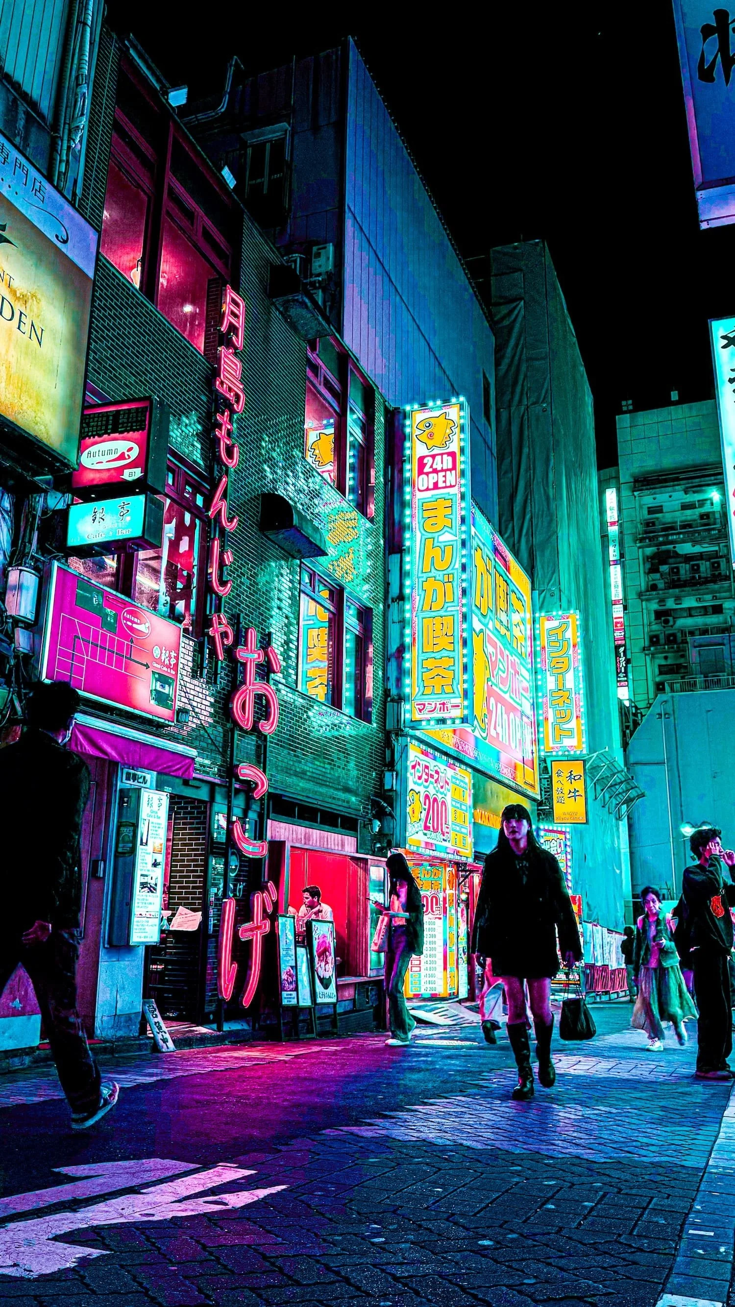 Night scene of a vibrant, neon-lit street in Japan with illuminated signs and people walking.