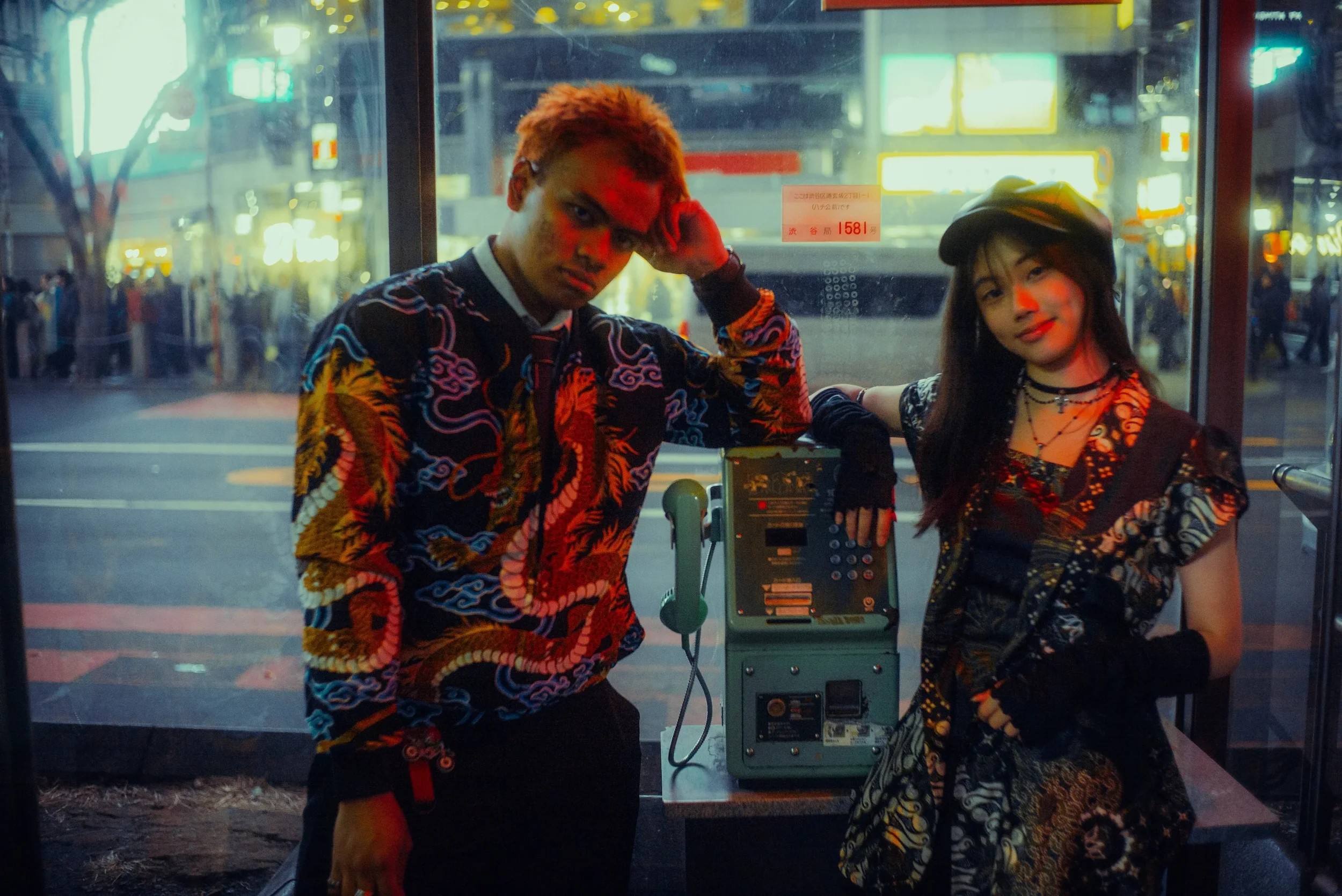 Couple posing together during a cinematic Tokyo night photoshoot
