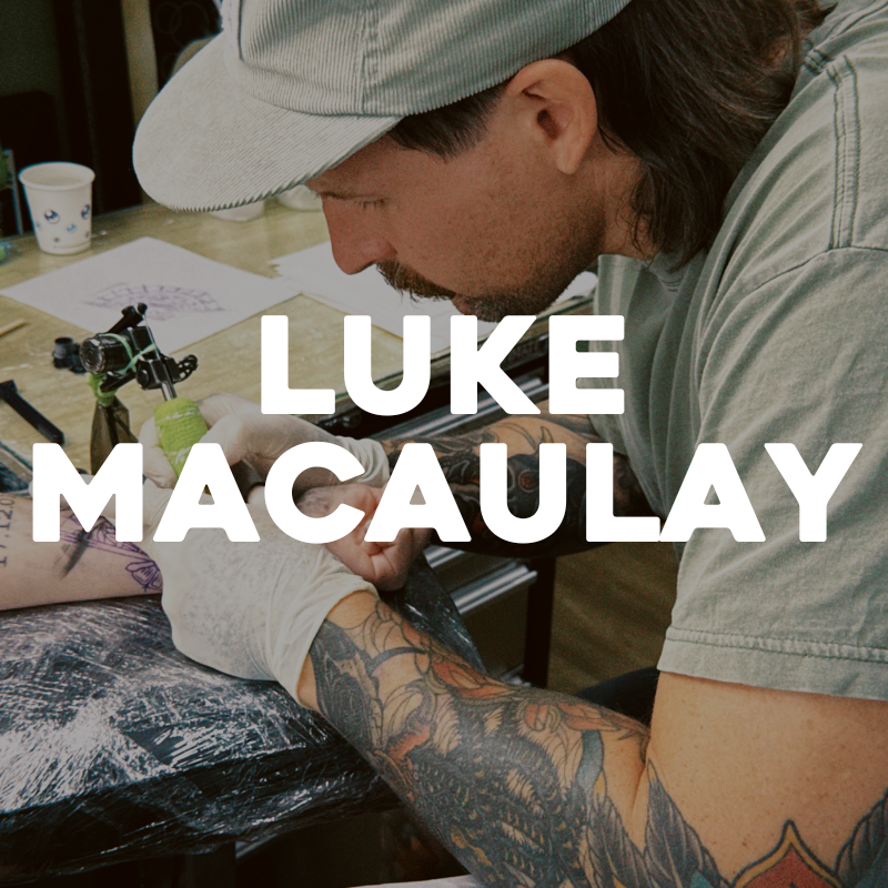 luke macaulay tattoo artist at victory tattoo co on the sunshine coast tattooing a wrist