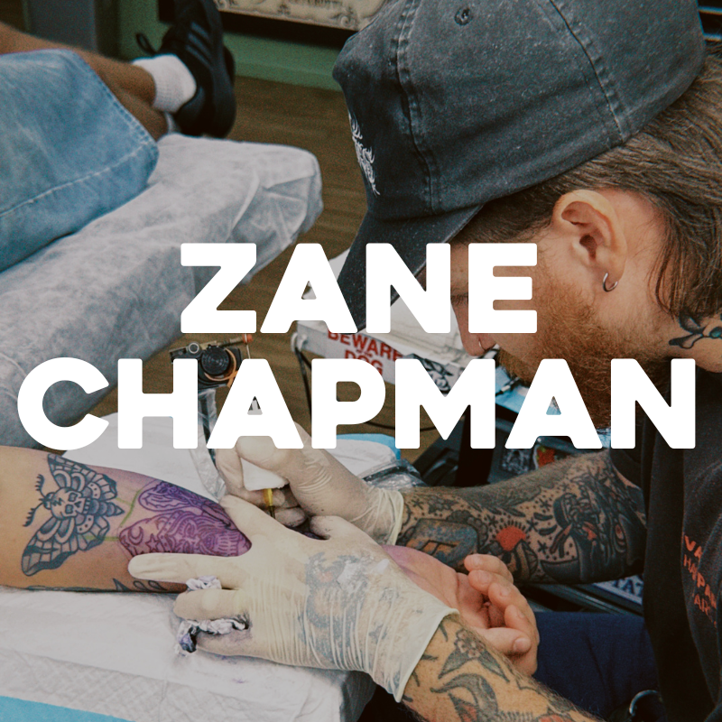 zane chapman tattooing a traditional tattoo design on a forearm in maroochydore sunshine coast
