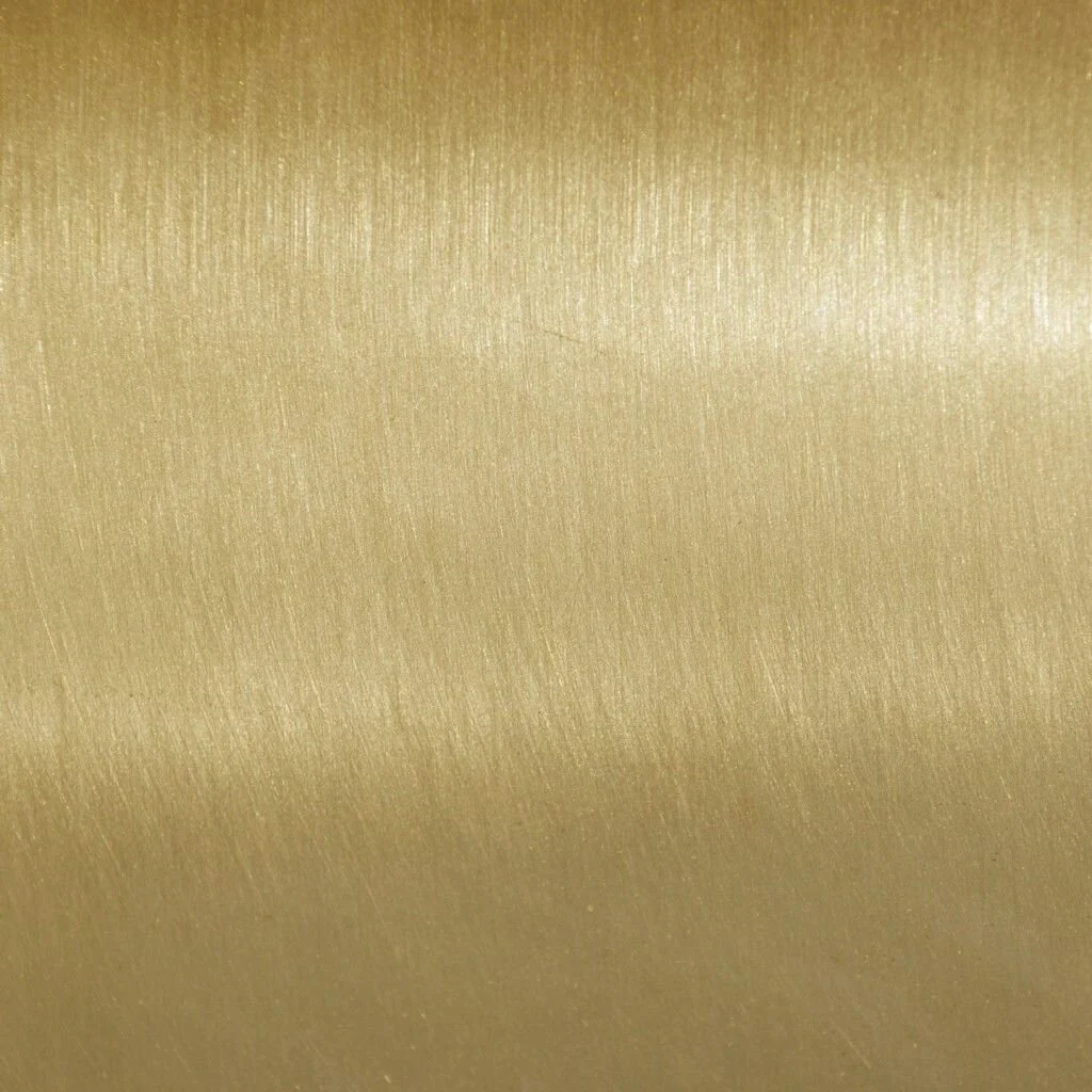 Close-up of a metallic gold surface with a subtle texture.