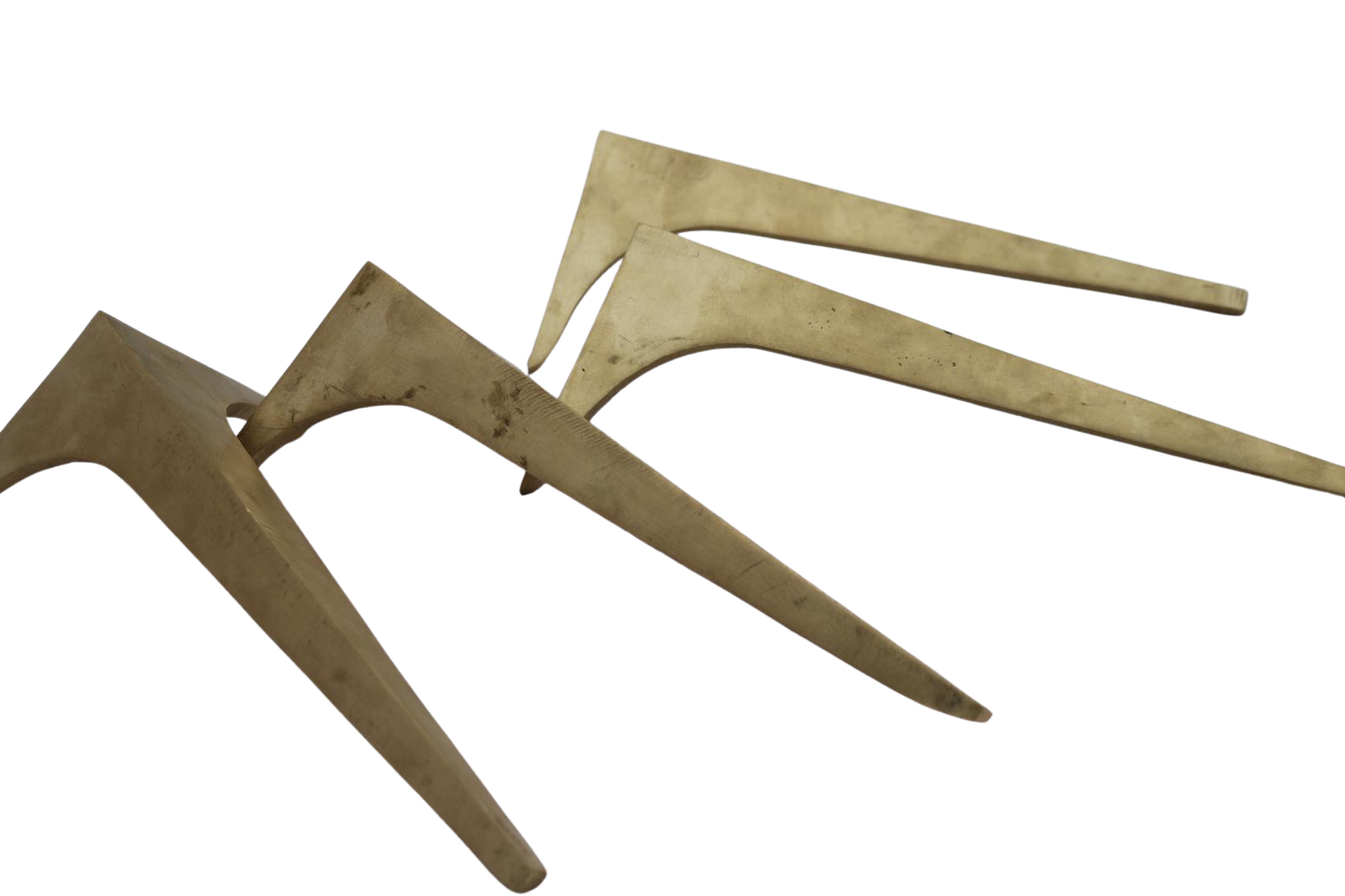 A set of three antique metal agricultural cultivator tines with a weathered and slightly rusted appearance, arranged diagonally against a white background.