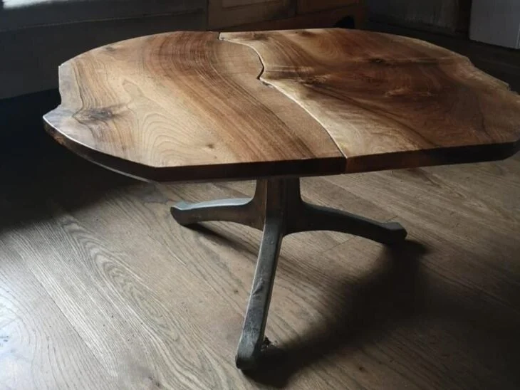 triple bronze wishbone legs with book matched coffee table top