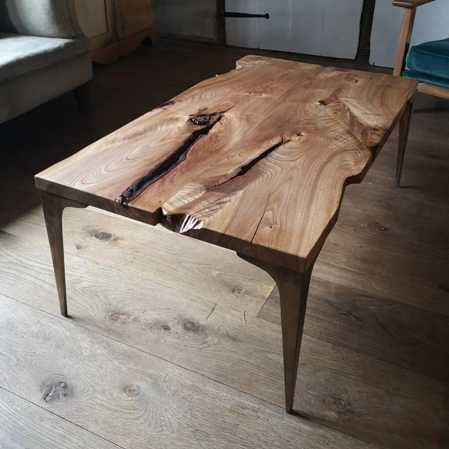 Book Matched English Elm Coffee Table on Bronze Stiletto Legs