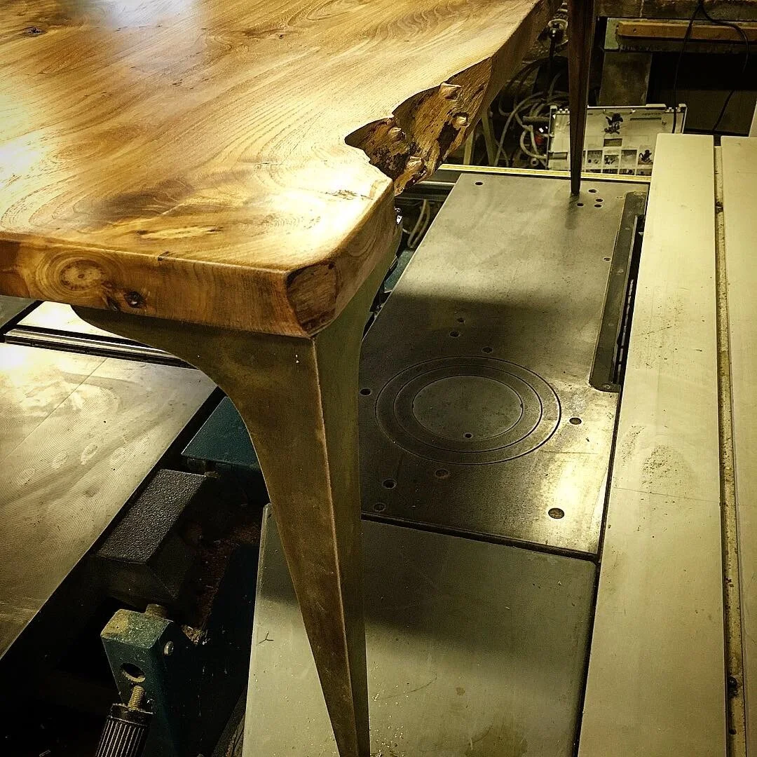 Book Matched English Elm Coffee Table on Bronze Stiletto legs
