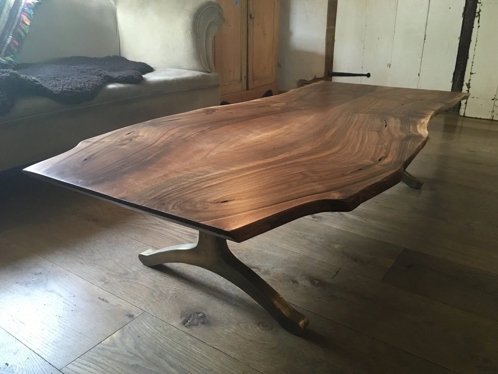 Live Edge English Walnut Coffee Table Sitting on Antiqued Bronzed Wishbone Legs
