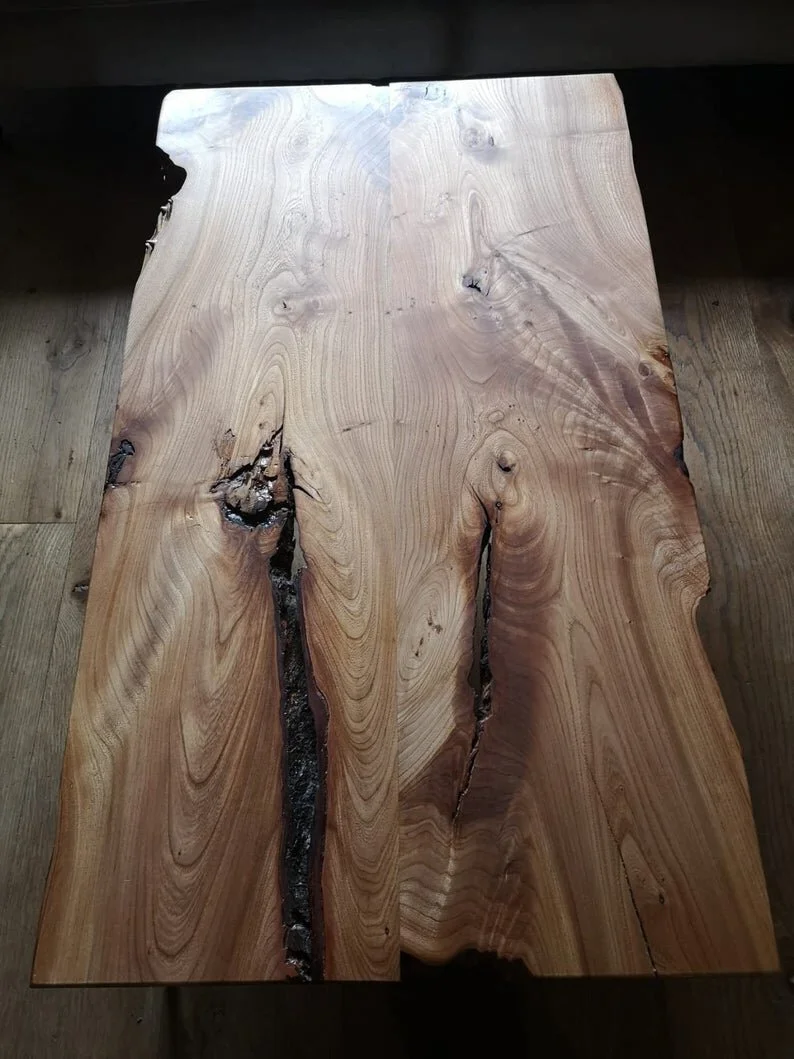 Book Matched English Elm Coffee Table on Bronze Stiletto legs