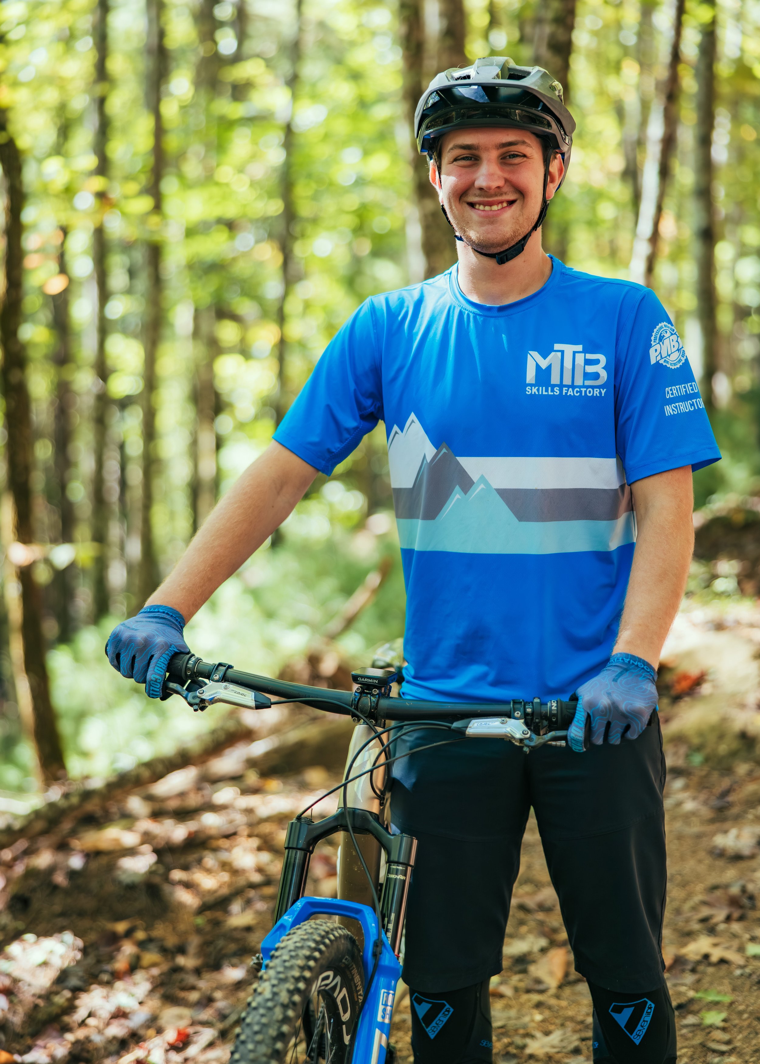 Mountain Bike Guide Smiling With his Gear ready to take riders down the trail