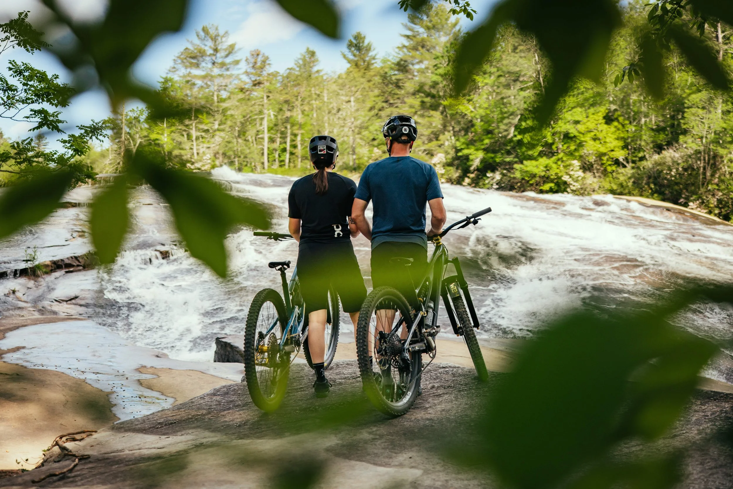 Mountain Bikers enjoying Bridal Veil Falls on a Guided MTB Ride
