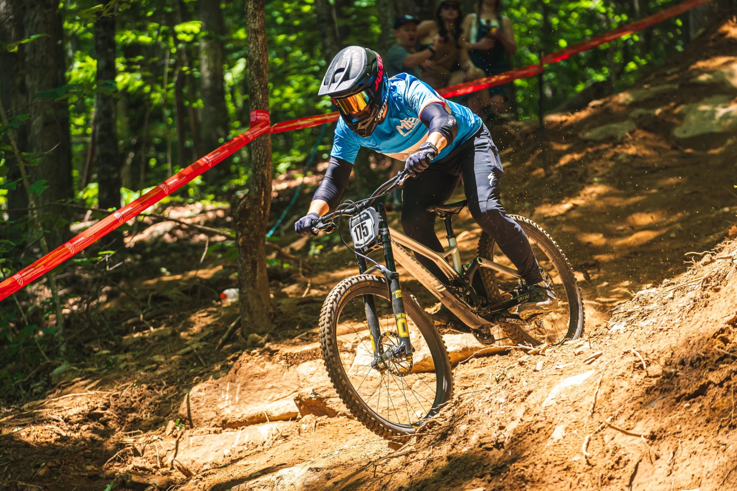Head Coach Josh Whitmore rides his downhill bike on a steep and loose technical section at Beech Mountain Bike Park