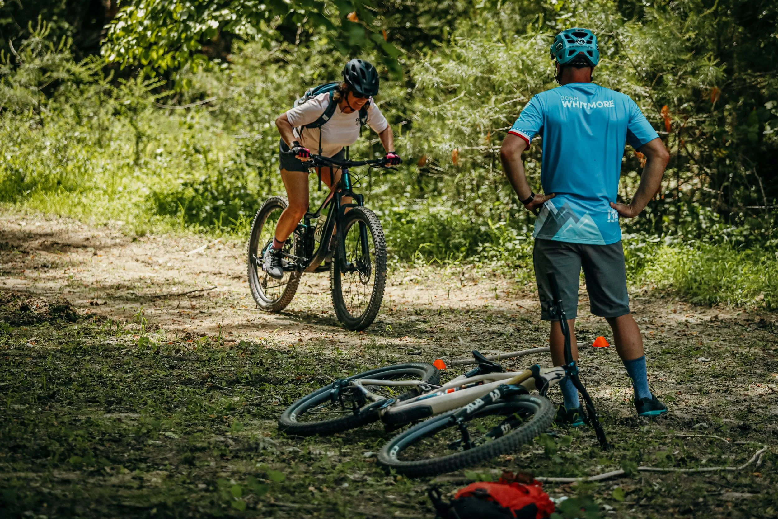 a rider tries a drill in front of coach Josh Whitmore atMountain biking class for fundamentals