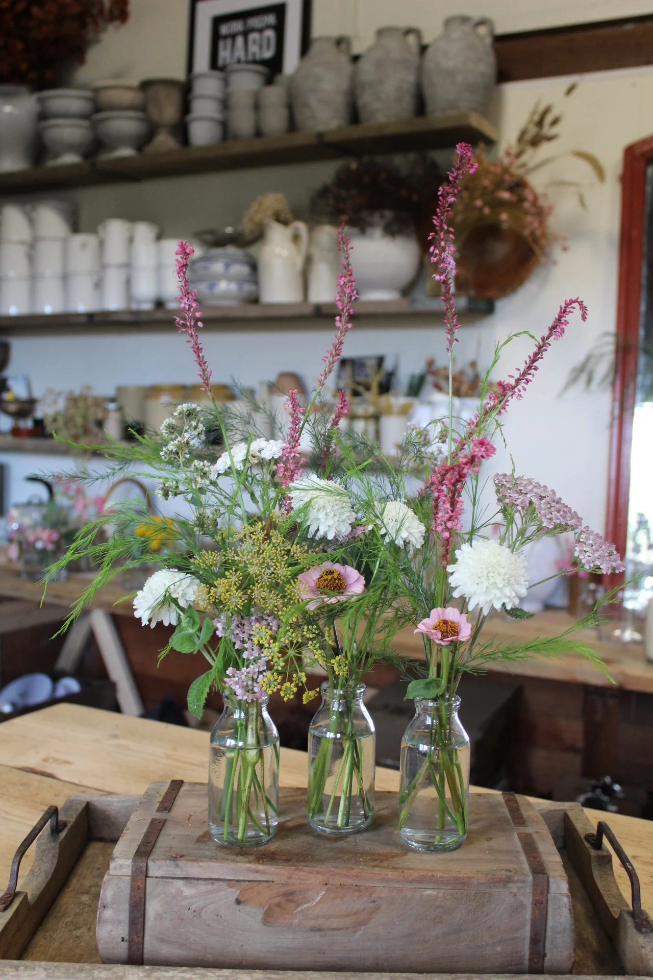 Small-Wedding-Bud-Vases-Arranged-on-the-Workbench..jpeg