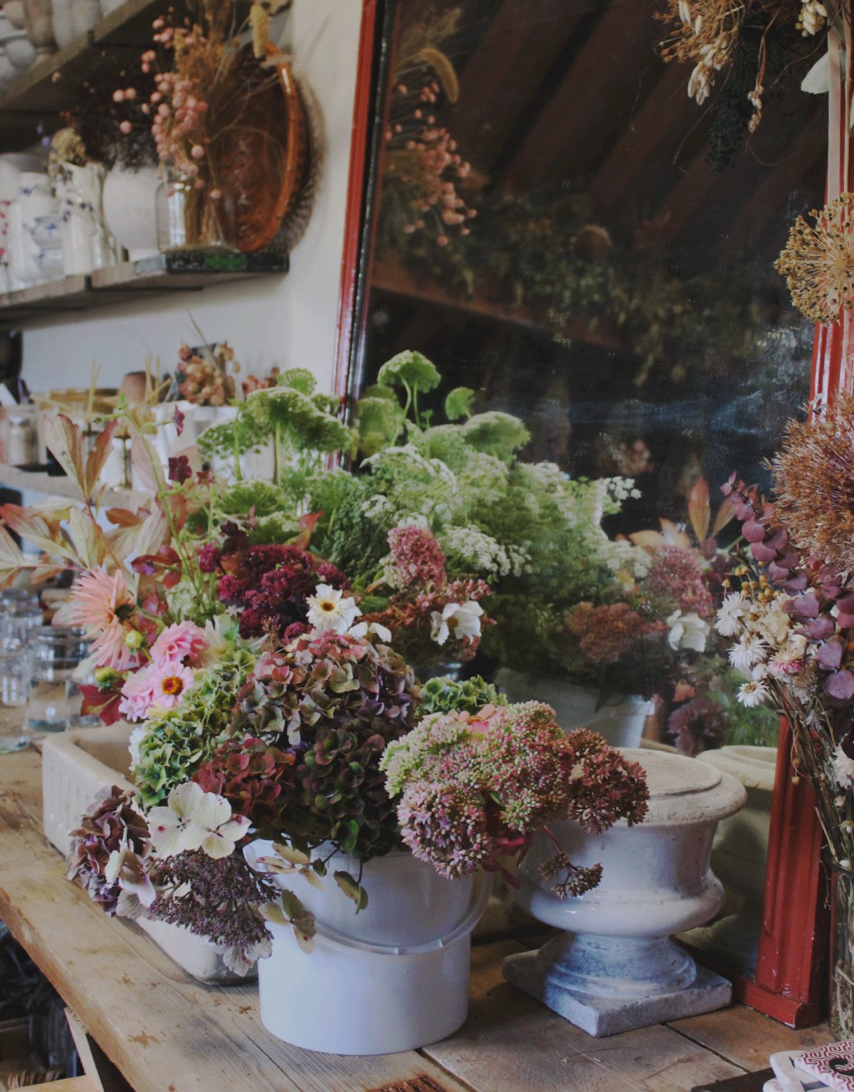 Autumn floral arrangement of dahlias, hydrangeas, seed heads and seasonal flowers in the Potager studio.