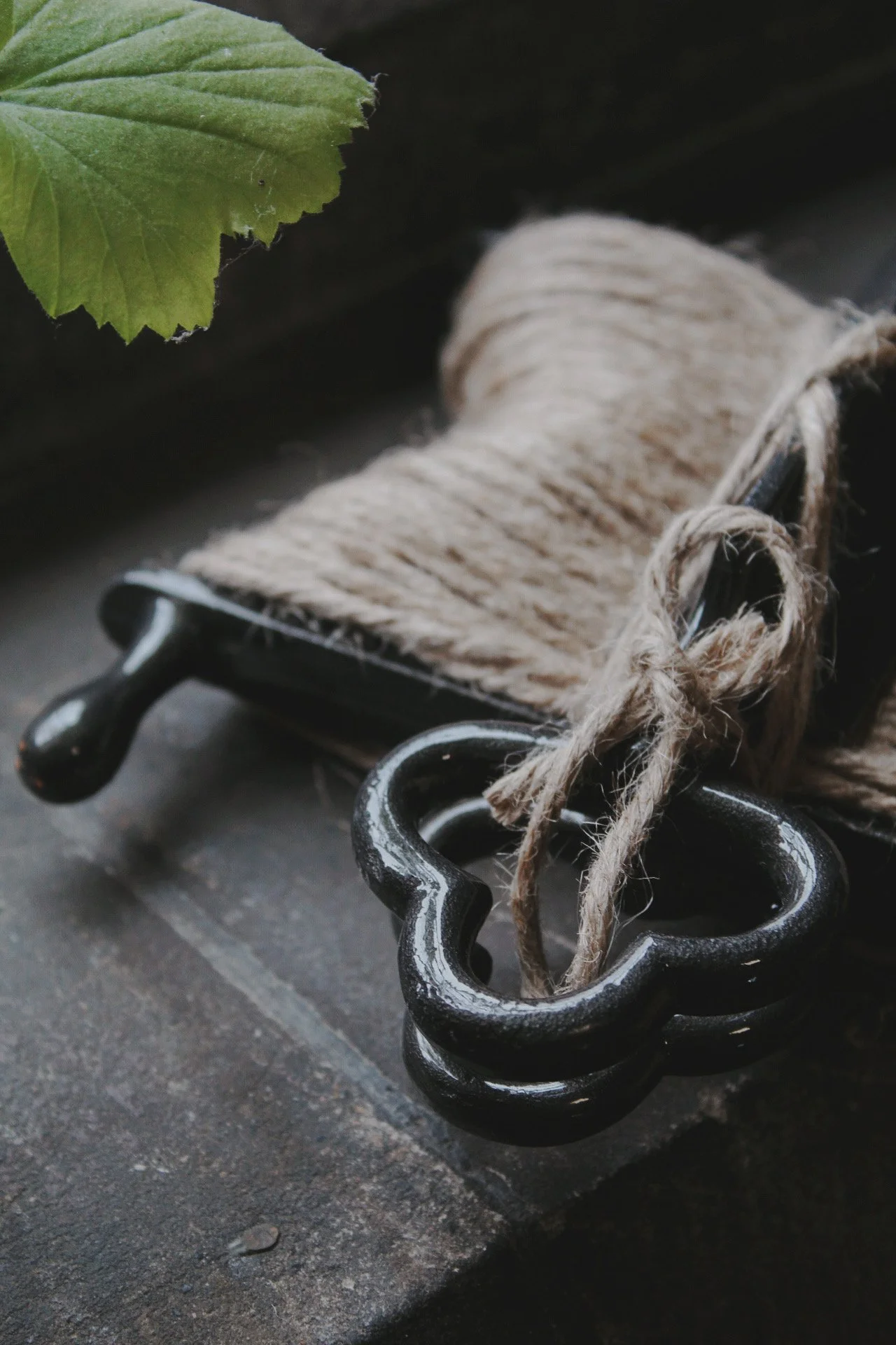Potager Line garden tool with natural jute twine hanging beside a window.