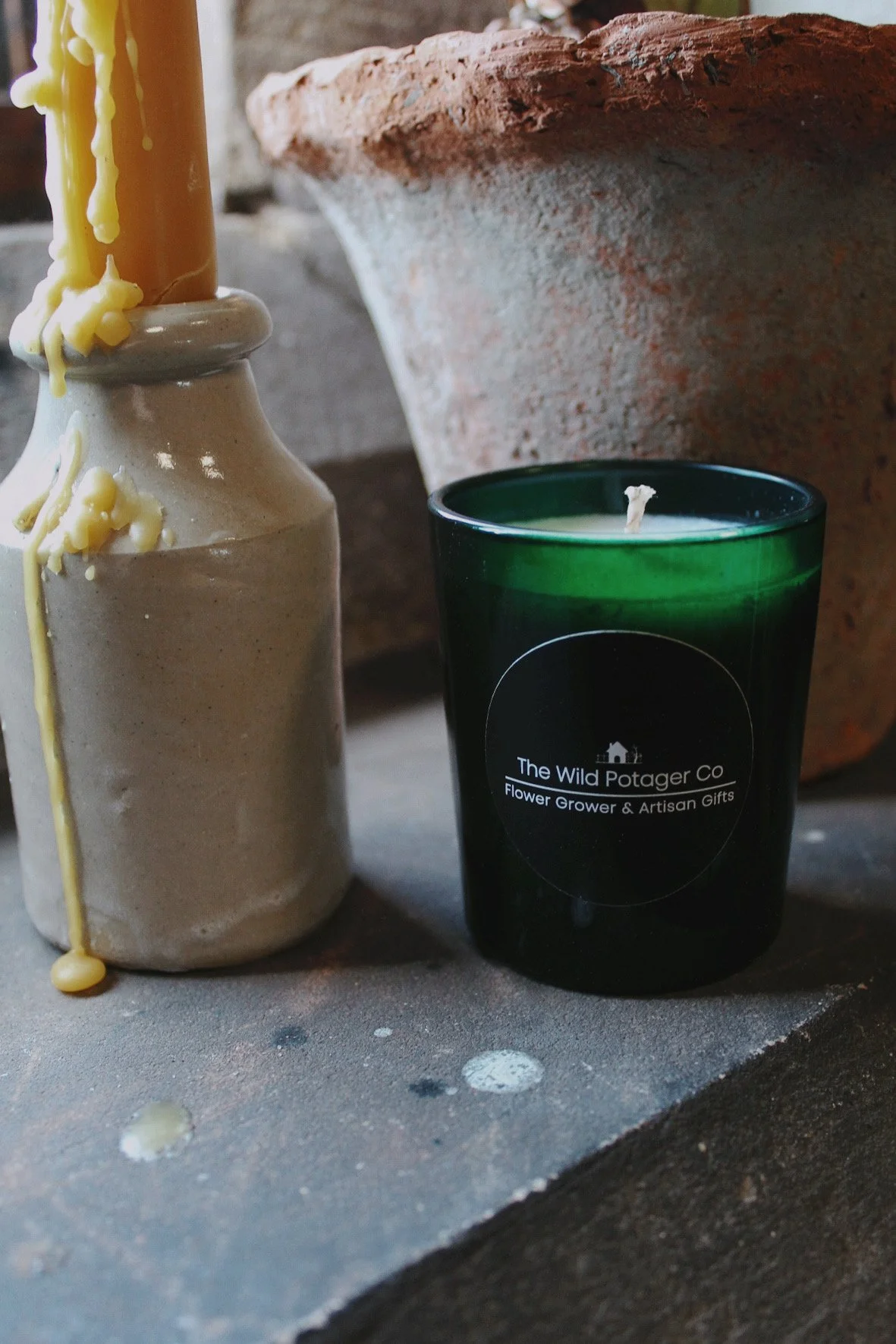 Chalk, moss and resin glass candles from The Wild Potager Co. photographed together in the potager studio.