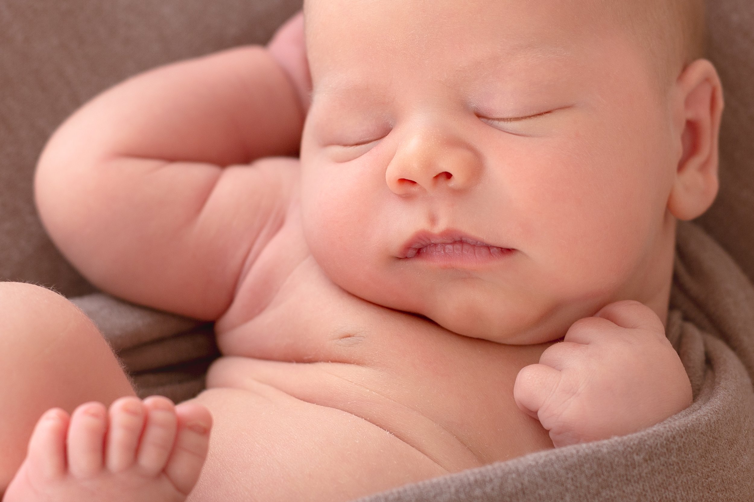 infant boy in modified huck finn pose newborn photography