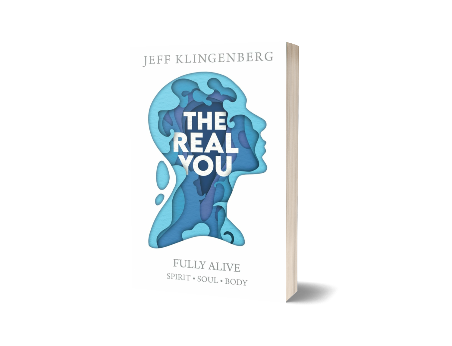 Book titled 'The Real You' by Jeff Klingenberg, featuring a cover with a layered profile of a woman's face in blue tones and the text 'Fully Alive: Spirit, Soul, Body' at the bottom.
