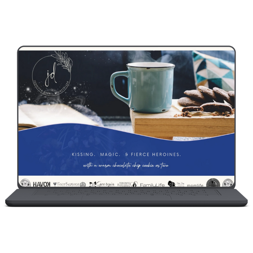 A computer screen showing a website with a teal mug and cookies on a wooden surface, a blue and white patterned pillow, and text that reads 'Kissing. Magic. & Fierce Heroines.' with a smaller phrase about warm chocolate chip cookies.