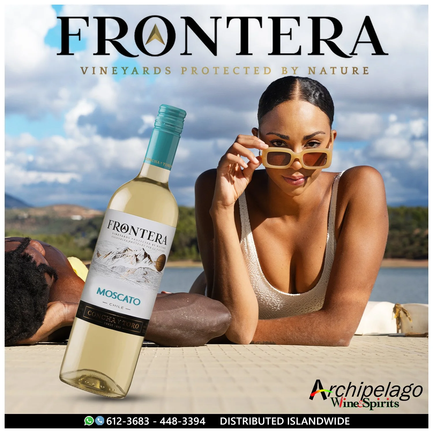 Advertisement for Fonterra vineyards featuring a woman wearing sunglasses lying face down by water, with a bottle of Fonterra Moscato wine in the foreground and the company logo at the bottom right.