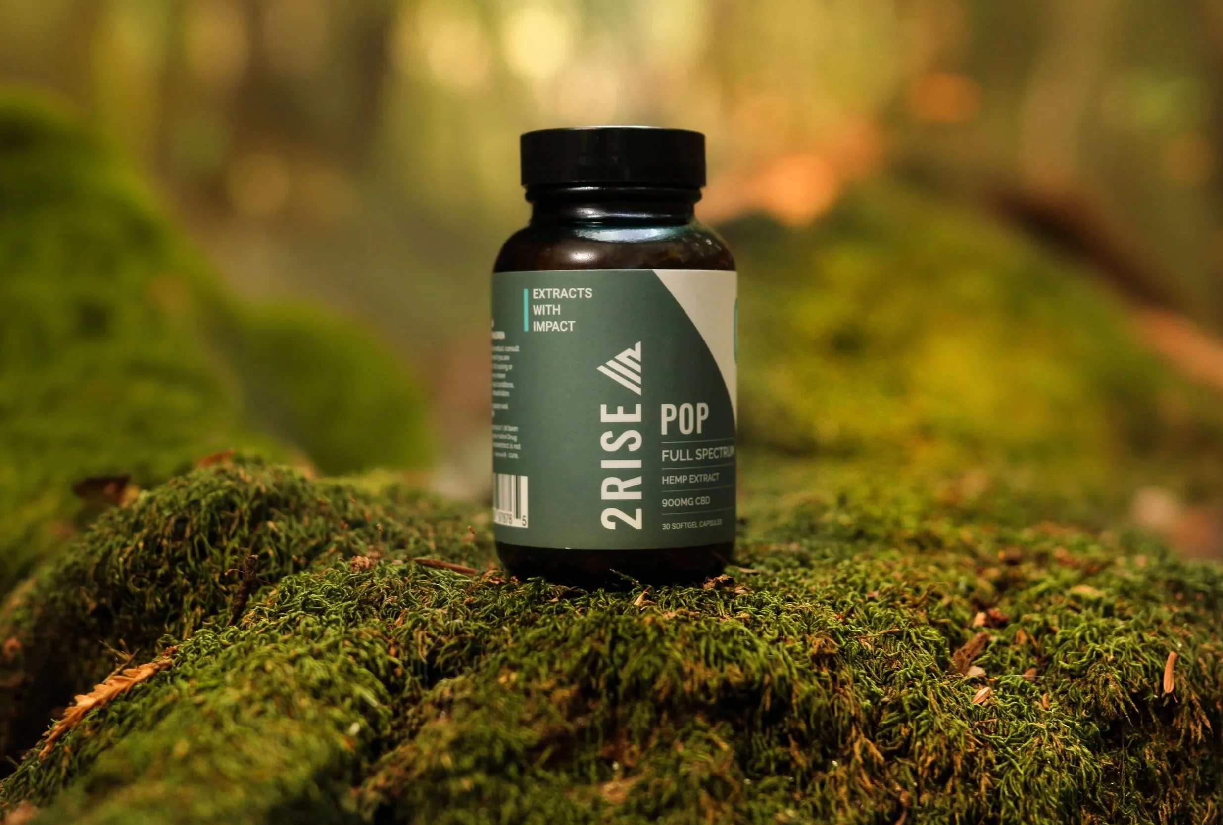 Wellness full-spectrum supplement bottle forest setting — wellness product photographer Los Angeles
