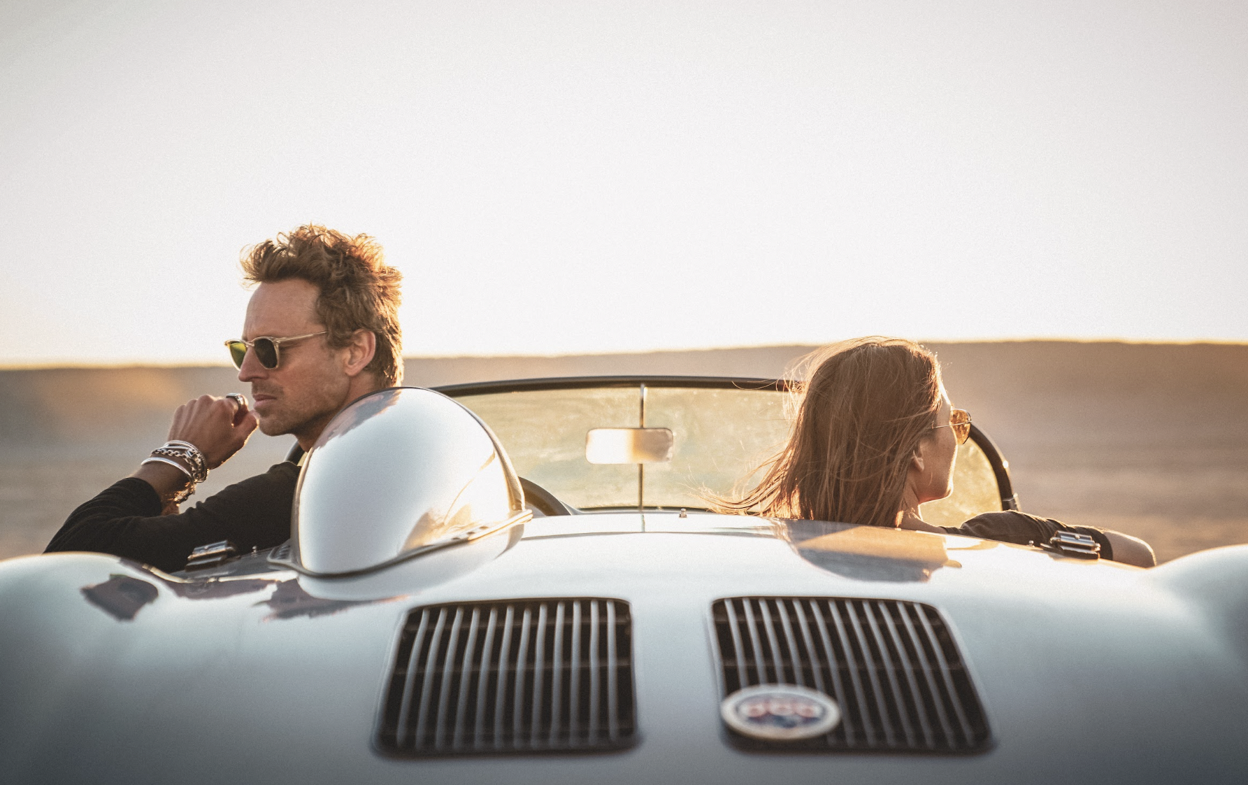 Malibu jewelry lifestyle campaign for Buck Palmer, photographed in a vintage convertible at sunset.