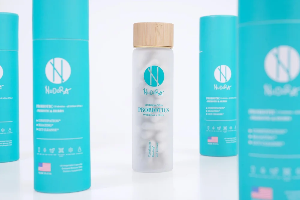 Teal supplement bottles studio product photography on white
