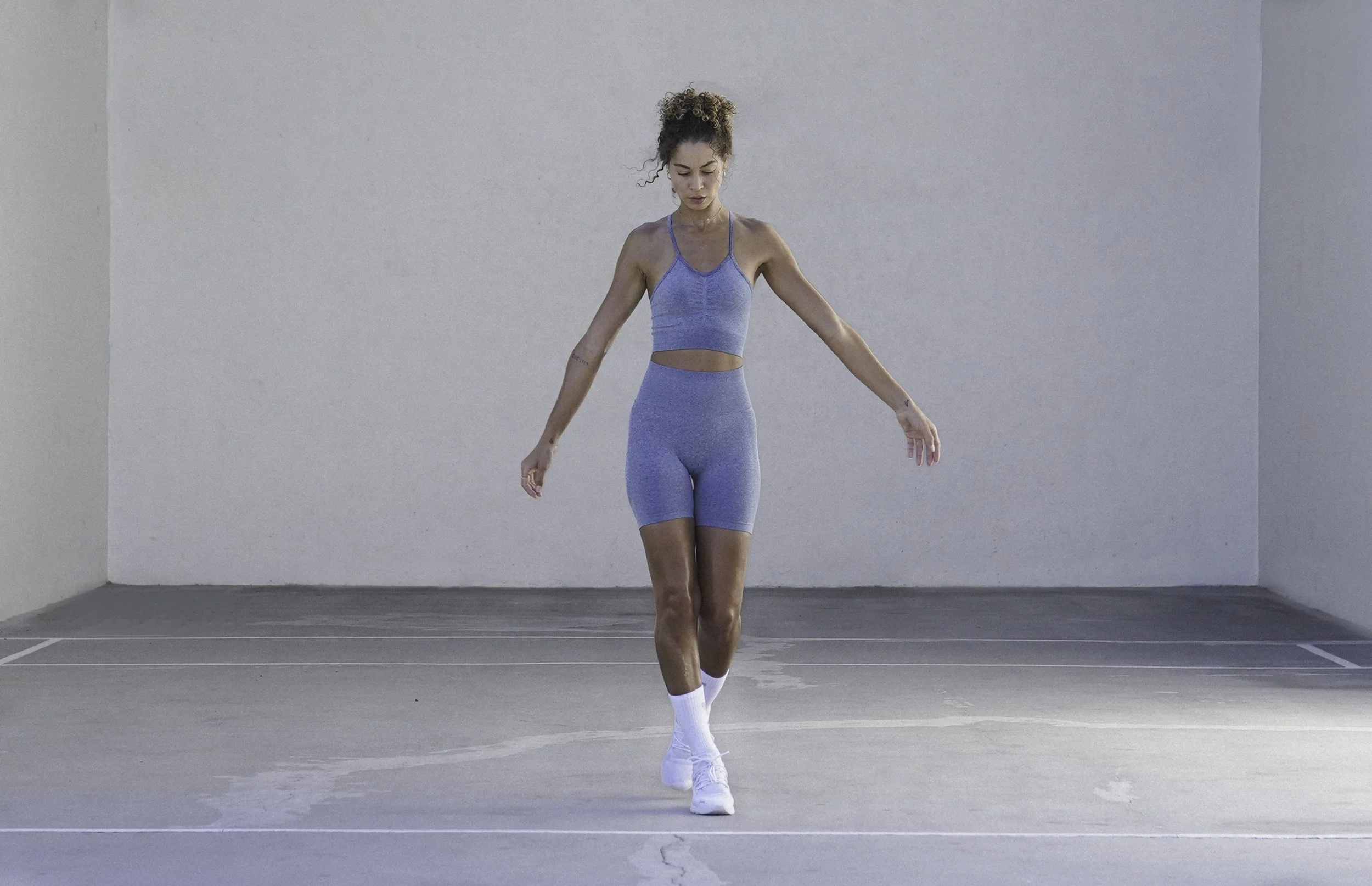 Modern athleisure fashion shoot featuring woman in matching blue gym outfit.jpg