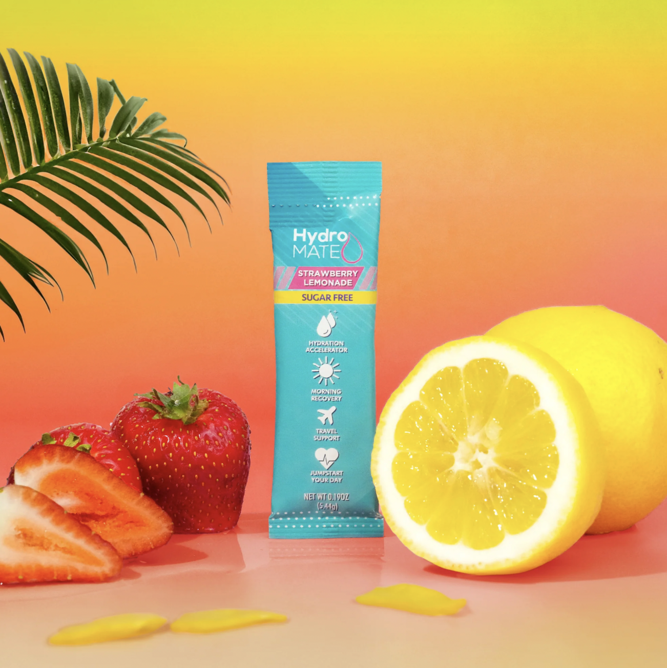 Hydromate Strawberry Lemonade packet with fresh citrus fruits — supplement product photographer Los Angeles