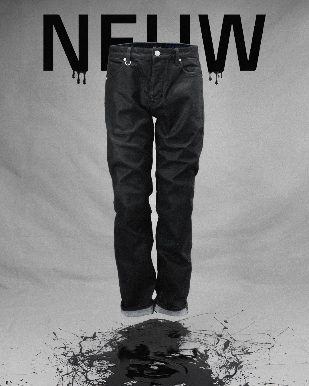 Front-facing product photograph of NEUW black denim jeans against a neutral studio backdrop