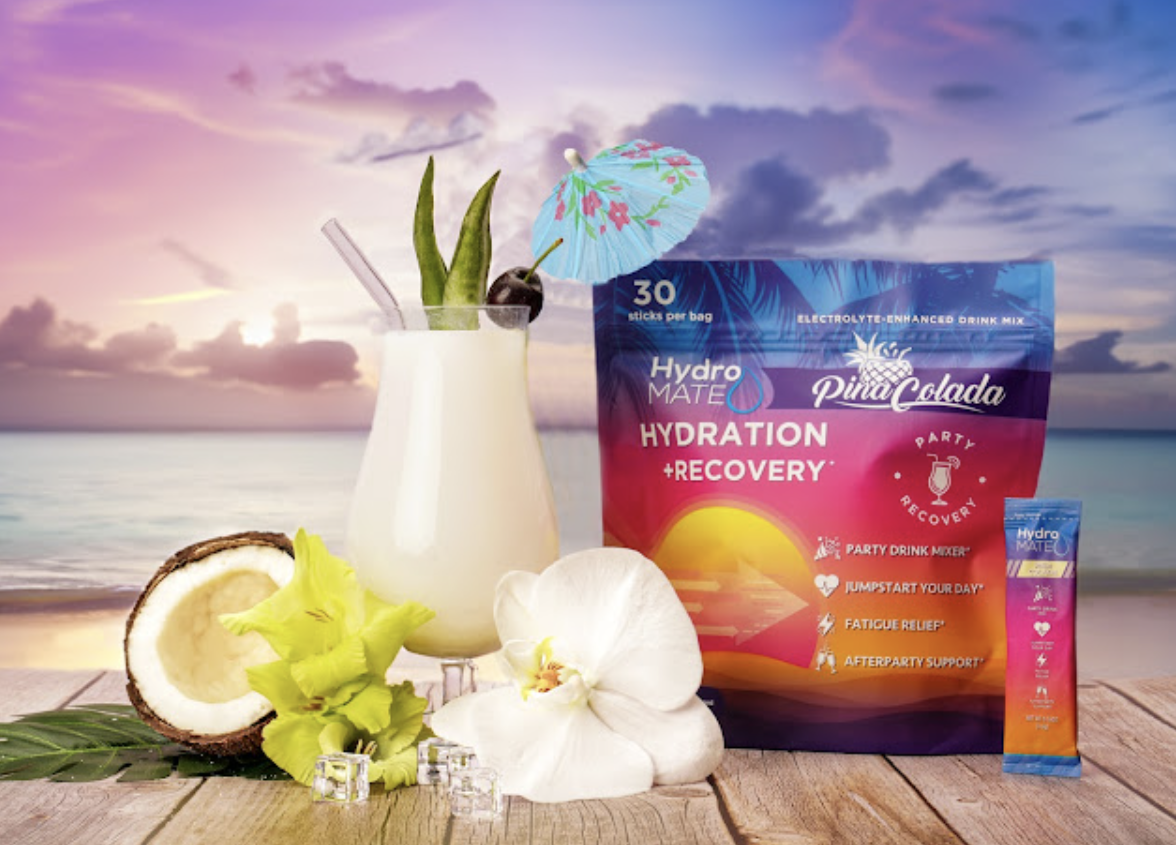 HydroMATE Piña Colada hydration and recovery supplement styled with coconut and tropical ingredients
