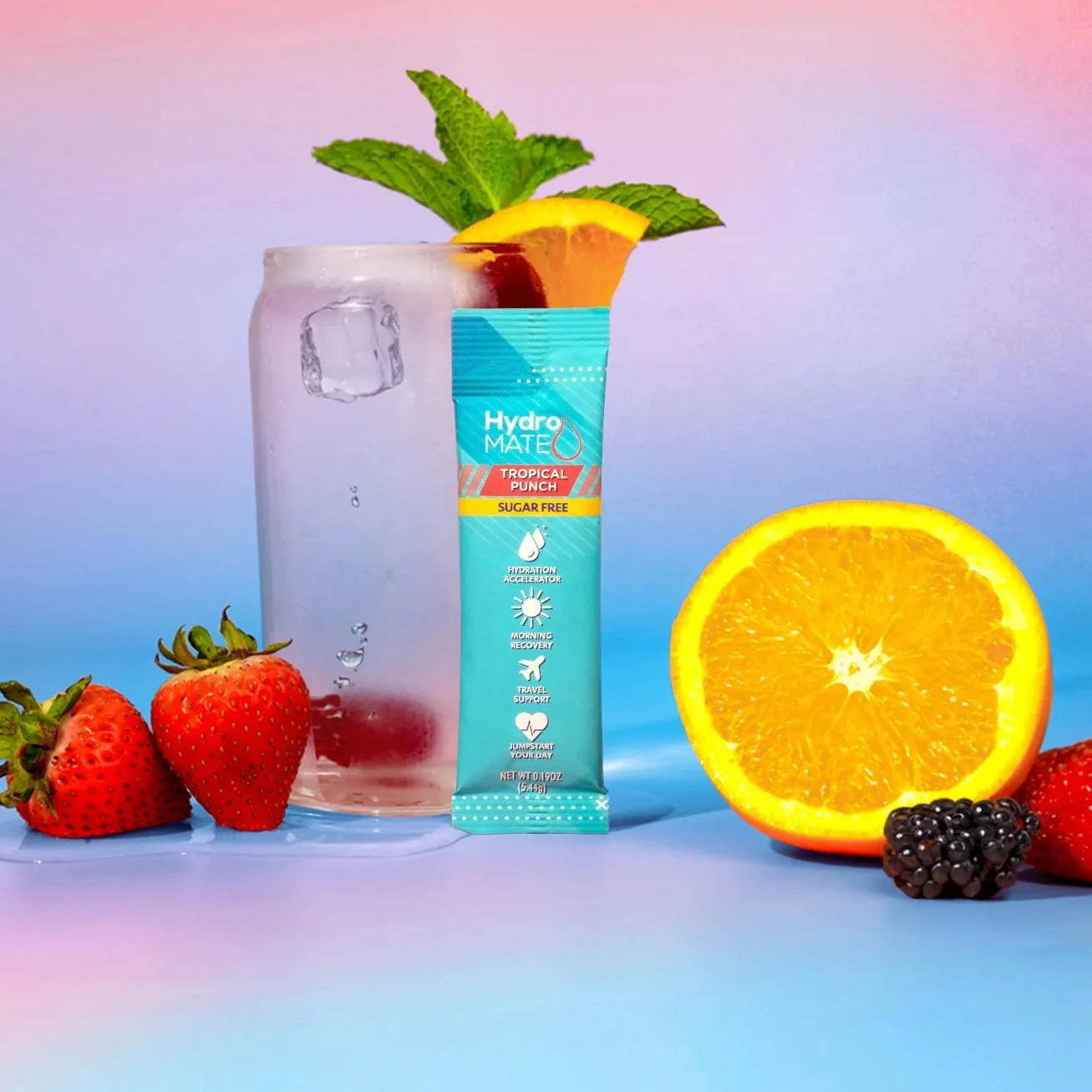 Tropical Punch hydration stick styled with fruit, ice and a drink against a pink-blue gradient, ecommerce product photography