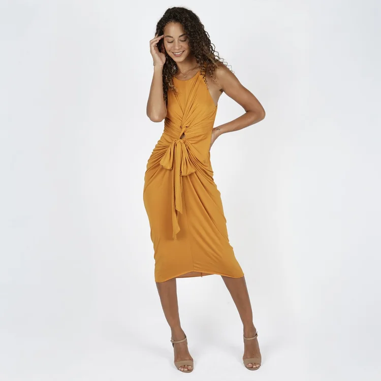 Womenswear e-commerce photography of a model in a yellow ruched dress