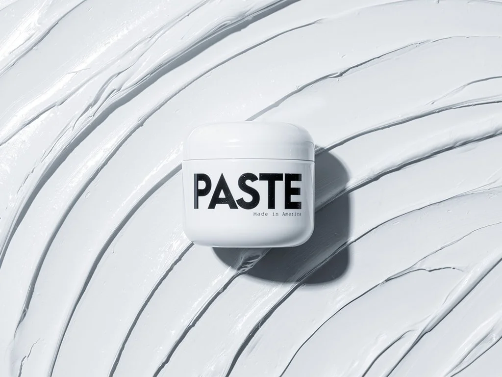 Los Angeles ecommerce product photography, hair paste jar close-up on white sculpted surface
