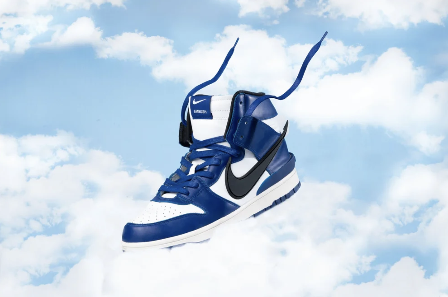 Studio product photography of Nike sneakers arranged in a cloud-inspired composition with soft blue tones and clean lighting